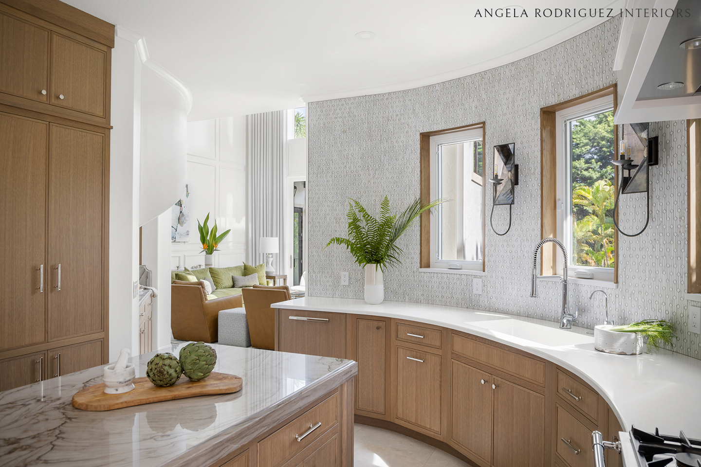 Kitchen design with curved wall and sconces