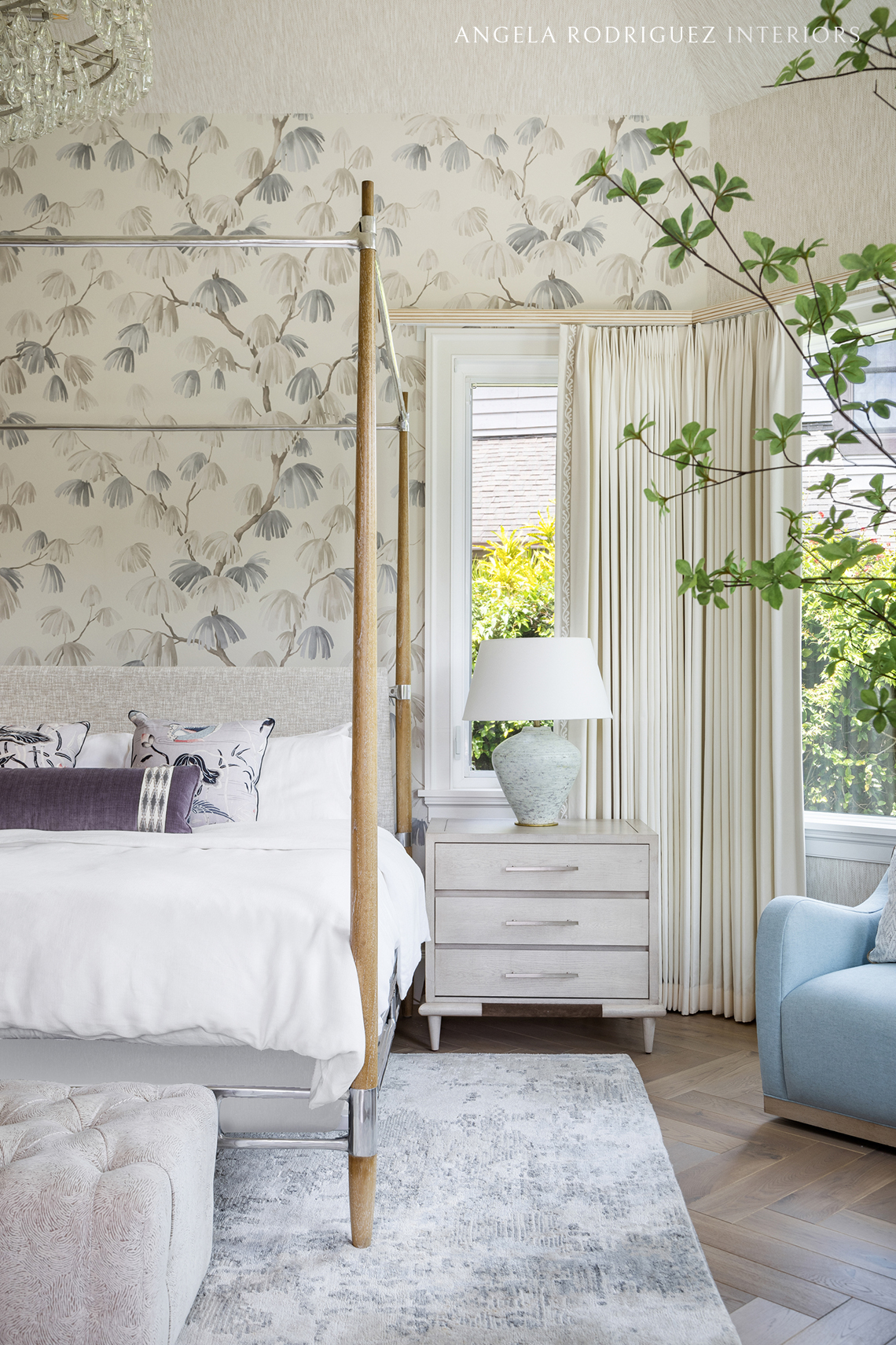 Bedroom design detail with furniture, wallpaper, and custom window treatments