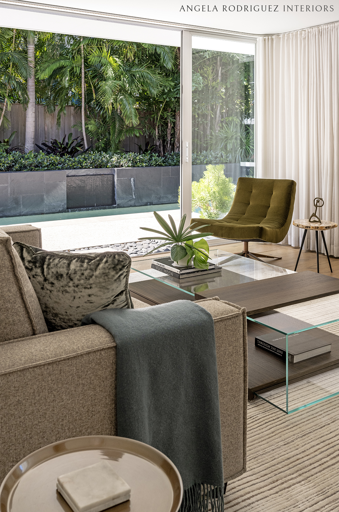 Contemporary lounge space with pool view