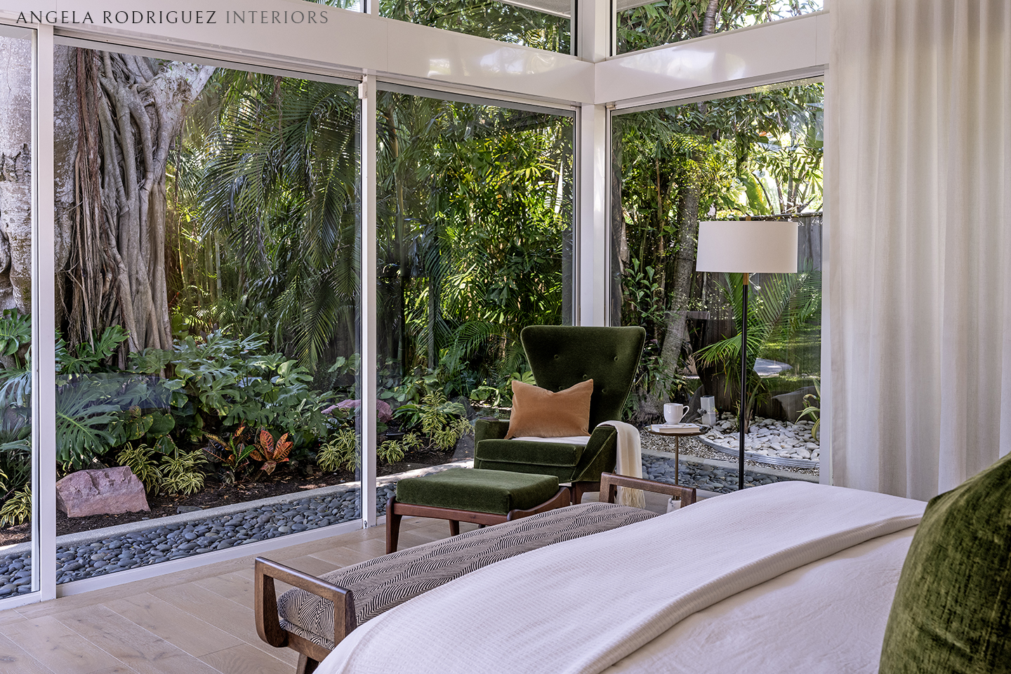 Modern master bedroom design with tropical garden view