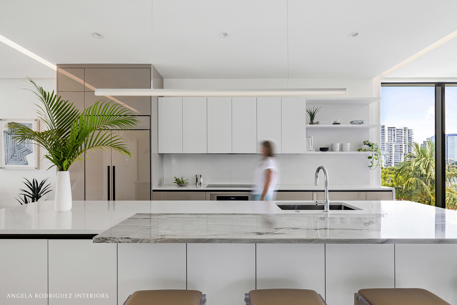Modern kitchen with person walking
