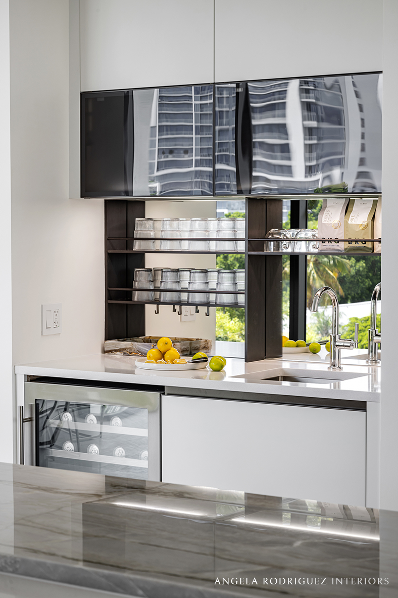 Built-in coffee bar in modern kitchen with lighting