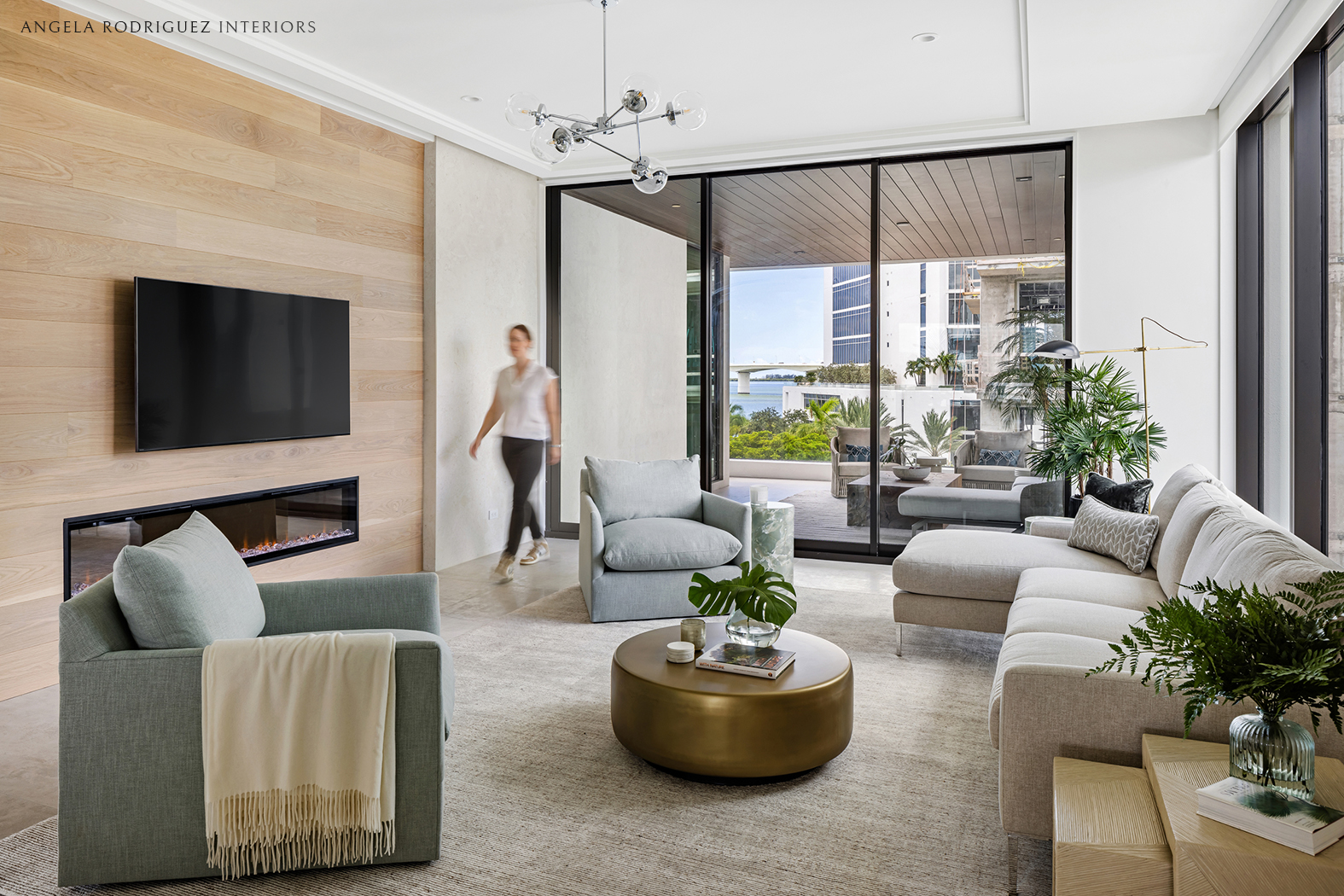 Contemporary living room with person walking