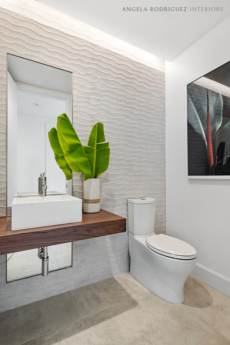 Powder room with textured wall tile