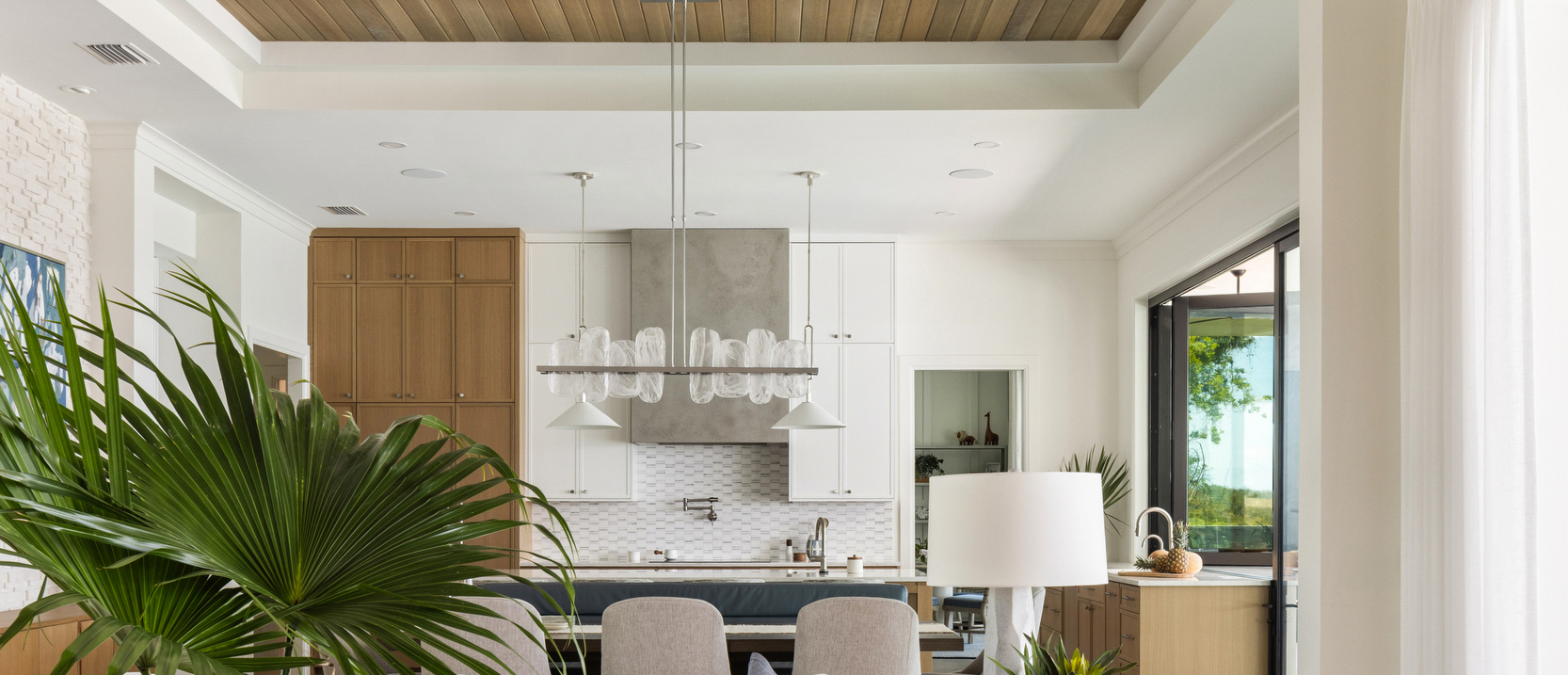 Great room design with custom kitchen beyond