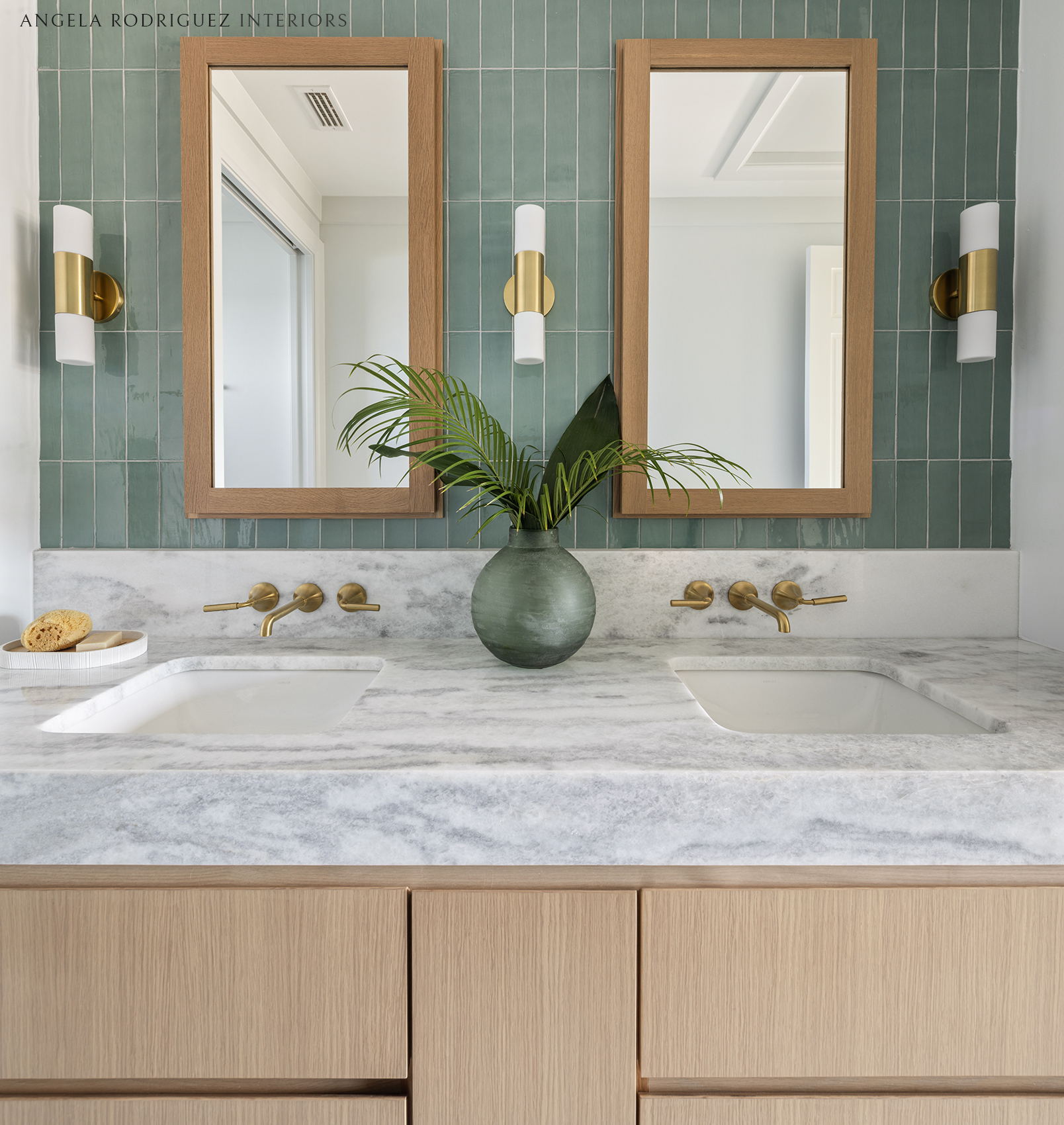 Bathroom with custom cabinetry and double sinks