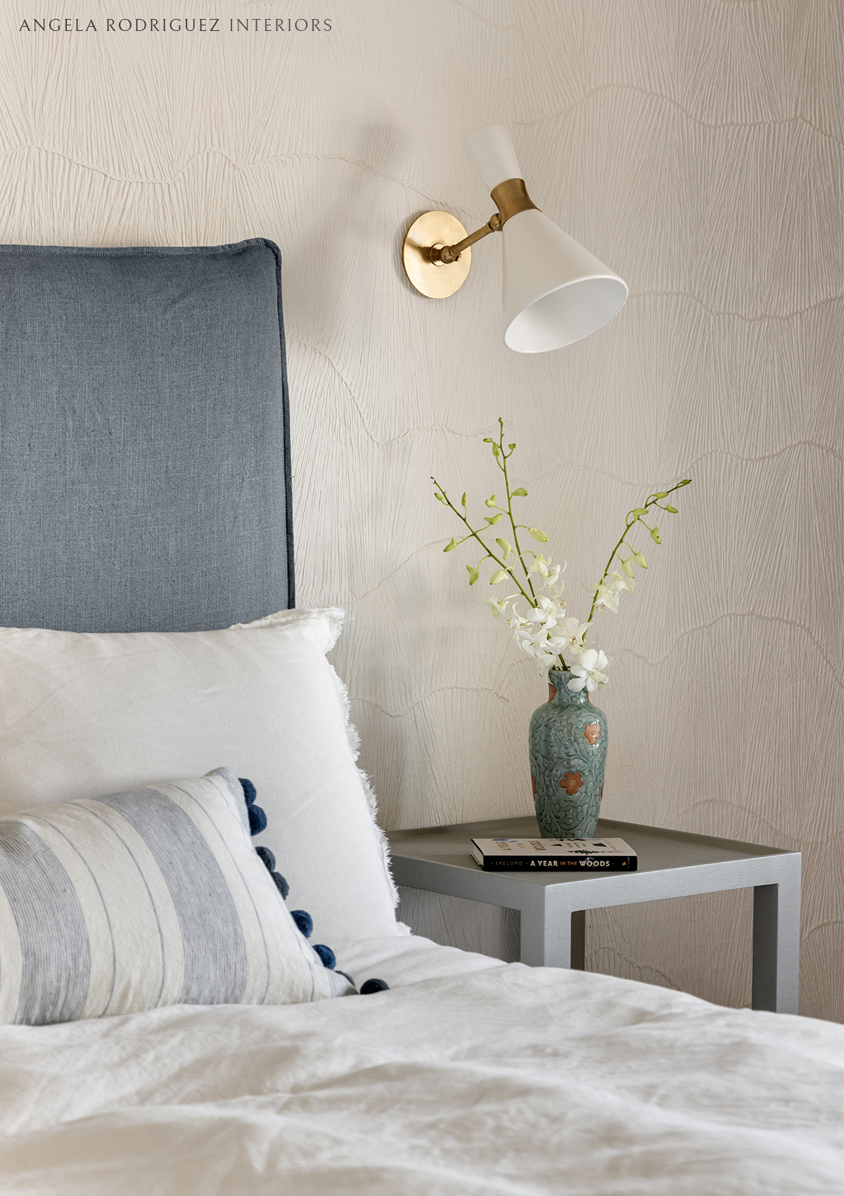 Close up detail of a bed and organic textured wall covering
