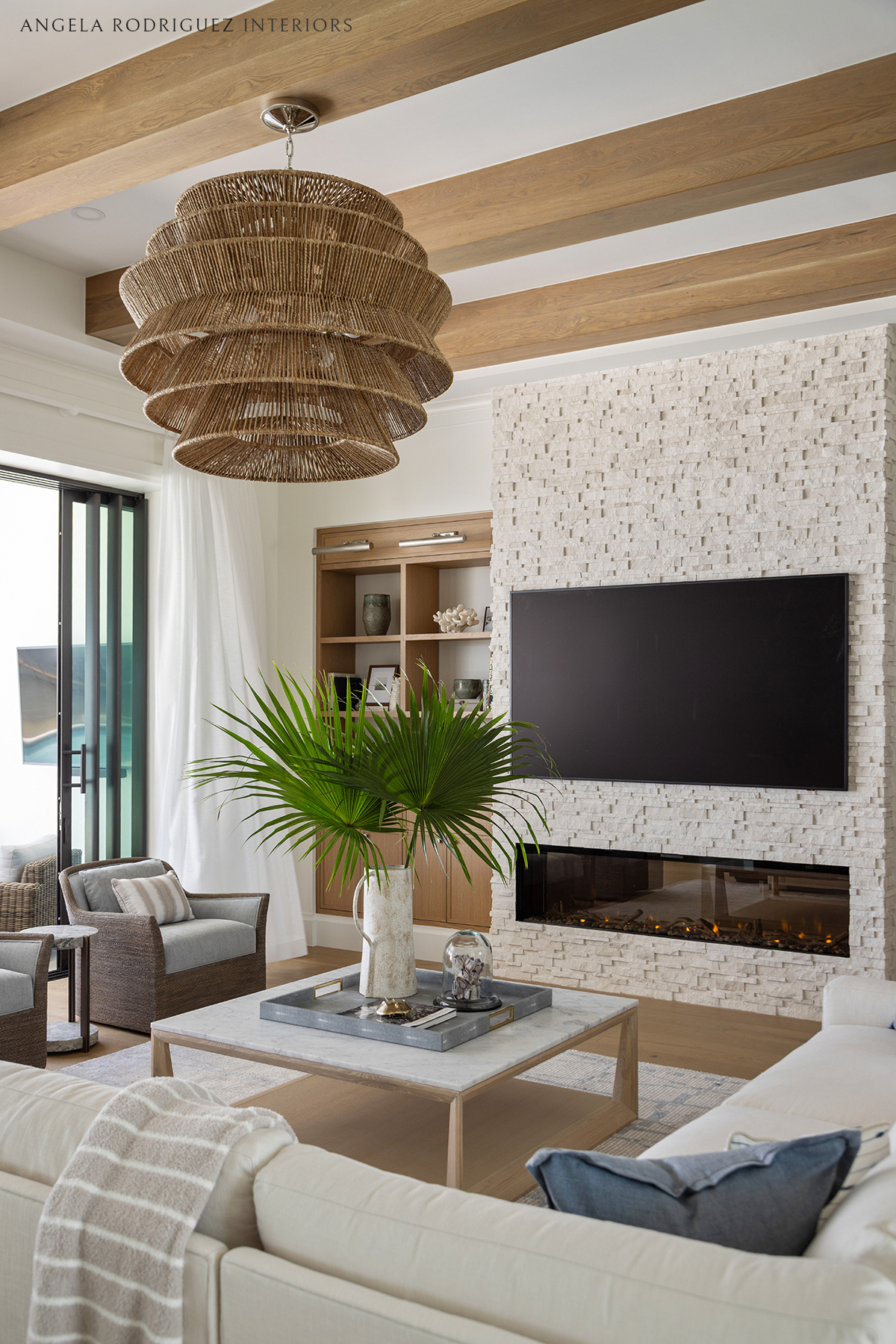 Sophisticated coastal great room with ceiling beams