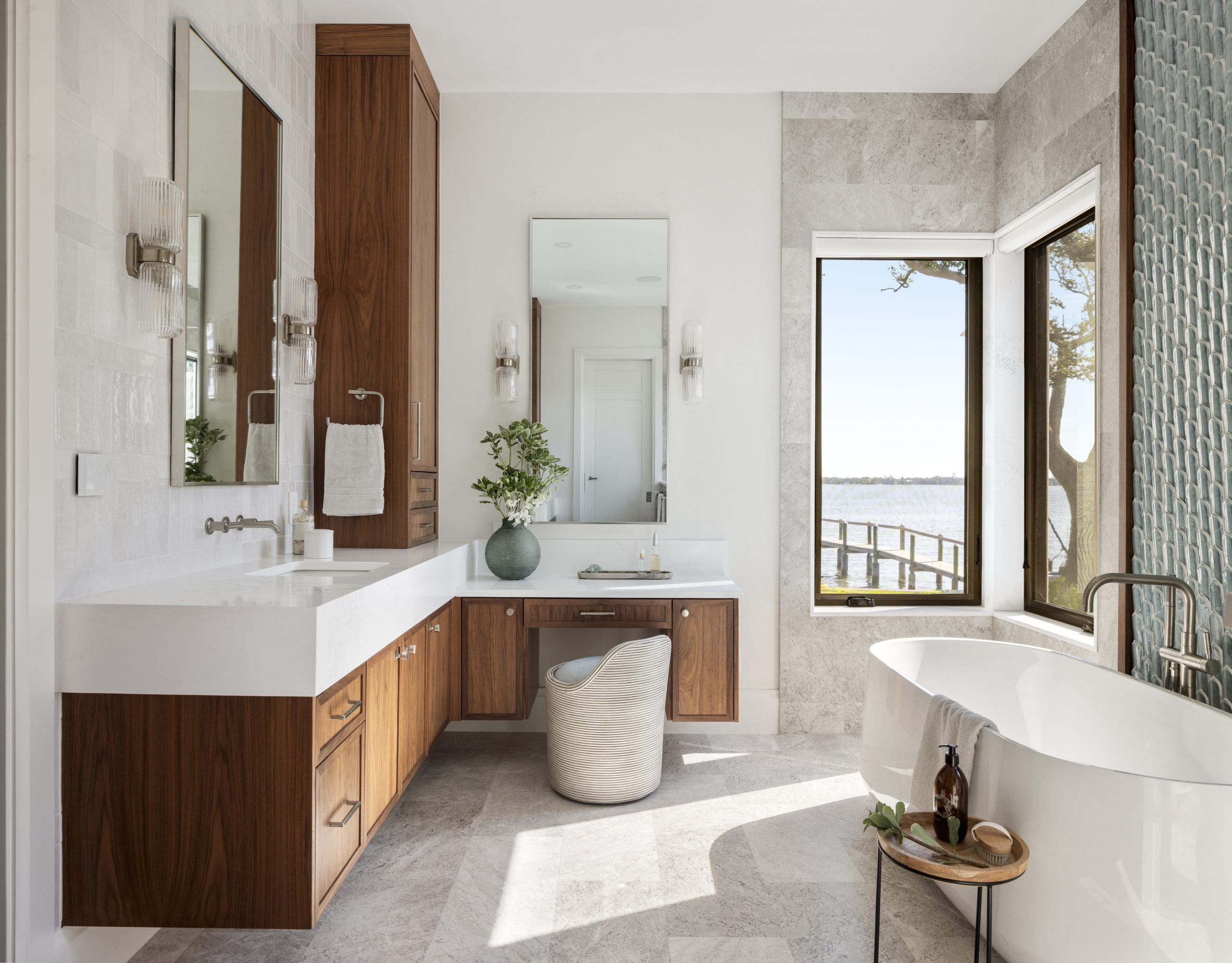 Bathroom with stone and wood materials and water view