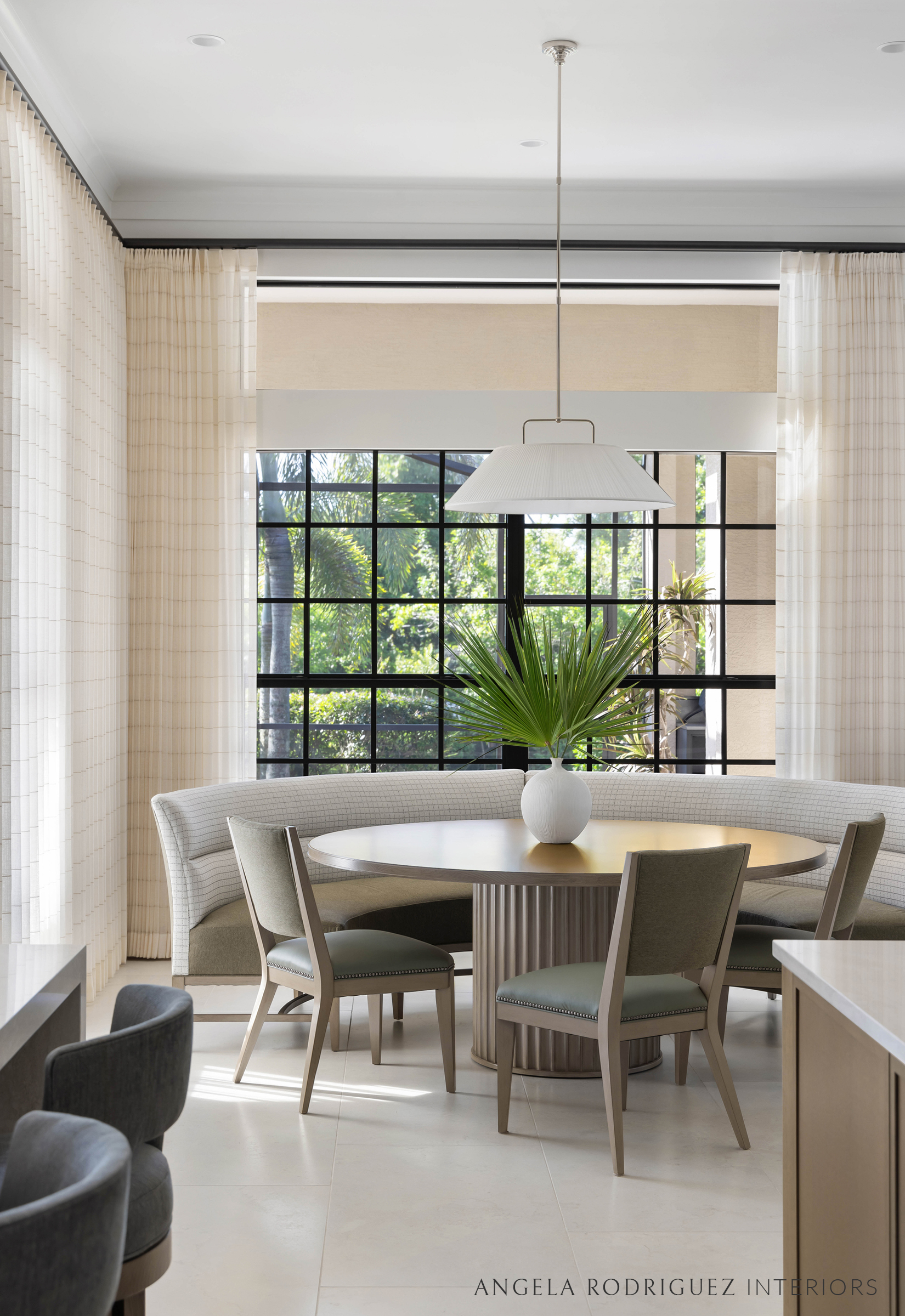 Kitchen and breakfast nook with sheer draperies